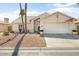 Inviting single-story home featuring a two-car garage, desert landscaping, and neutral color palette at 15377 W Cheery Lynn Rd, Goodyear, AZ 85395