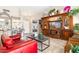 Bright living room showcasing tile floors, large windows, and a stately built-in entertainment center at 15377 W Cheery Lynn Rd, Goodyear, AZ 85395