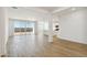 Bright and open living room with lots of natural light from the sliding glass doors and view of the kitchen at 15474 W Cottontail Ln, Surprise, AZ 85387