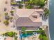 Overhead aerial shot of a home featuring desert landscaping, a pool, and a spa at 15563 W Roanoke Ave, Goodyear, AZ 85395