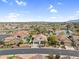 Panoramic aerial view of the community with mature trees and water features at 15563 W Roanoke Ave, Goodyear, AZ 85395