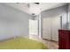 Bedroom featuring a closet with sliding doors and tile flooring at 16438 W Mescal St, Surprise, AZ 85388