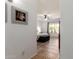 Hallway view of a primary bedroom with a ceiling fan, a window, and a padded storage bench at 16438 W Mescal St, Surprise, AZ 85388