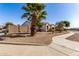 Charming single-story home with desert landscaping, arched entry and two-car garage at 16438 W Mescal St, Surprise, AZ 85388