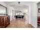 Inviting foyer featuring tile flooring, arched doorways and natural light at 16438 W Mescal St, Surprise, AZ 85388