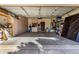 Spacious garage with ample storage cabinets and shelving units providing organized space for vehicles and belongings at 16438 W Mescal St, Surprise, AZ 85388