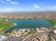 Stunning aerial view of the community lake, park, and distant mountain views at 16800 E El Lago Blvd # 2072, Fountain Hills, AZ 85268