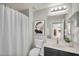 Bathroom featuring a single sink vanity, framed mirror, and shower with white curtain at 16800 E El Lago Blvd # 2072, Fountain Hills, AZ 85268