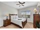 Cozy bedroom with neutral walls, wood furniture, and a window view at 16800 E El Lago Blvd # 2072, Fountain Hills, AZ 85268