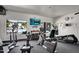 Well-equipped community gym with TV, free weights, and views of the pool area at 16800 E El Lago Blvd # 2072, Fountain Hills, AZ 85268