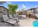 Poolside deck with comfortable lounge chairs and a covered BBQ area for entertaining guests at 16800 E El Lago Blvd # 2072, Fountain Hills, AZ 85268