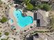 Overhead shot of a unique shaped community pool and spa surrounded by lounge chairs at 16800 E El Lago Blvd # 2072, Fountain Hills, AZ 85268