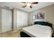 Bedroom with large closet and ceiling fan at 16881 W Monroe St, Goodyear, AZ 85338