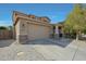 Charming two-story home featuring a two-car garage, landscaped yard, and inviting front porch at 16881 W Monroe St, Goodyear, AZ 85338