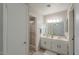 Bright bathroom featuring a double sink vanity and glass-enclosed shower at 1753 E Shasta St, Casa Grande, AZ 85122