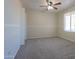 A spacious bedroom featuring carpet floors, a window, and ceiling fan at 1753 E Shasta St, Casa Grande, AZ 85122