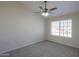 Bright and spacious bedroom with soft carpet and a large window at 1753 E Shasta St, Casa Grande, AZ 85122