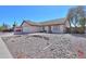 Single-story home with low-maintenance desert landscaping and a cozy front porch bench at 1753 E Shasta St, Casa Grande, AZ 85122