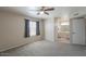 A spacious main bedroom with carpeting and an ensuite bathroom at 1753 E Shasta St, Casa Grande, AZ 85122