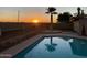 Backyard in ground swimming pool during sunset at 1753 E Shasta St, Casa Grande, AZ 85122