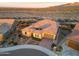 Aerial shot of a stunning home in a desert landscape, showcasing its tile roof and desert landscaping at 19051 N 259Th Ave, Buckeye, AZ 85396