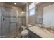 Modern bathroom with glass-enclosed shower, stylish tile accents, and vanity with sink at 19051 N 259Th Ave, Buckeye, AZ 85396