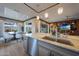 Modern kitchen island boasts marble countertop, stainless sink, and an open dining area at 19051 N 259Th Ave, Buckeye, AZ 85396