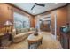 Cozy living room with ornate rug, recessed lighting, and french doors to an adjacent room at 19051 N 259Th Ave, Buckeye, AZ 85396