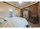 Warm main bedroom showcasing neutral color tones, recessed lighting, and ensuite bathroom at 19051 N 259Th Ave, Buckeye, AZ 85396