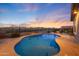 Sparkling swimming pool with mountain views and a desert sky, enhancing the outdoor living experience at 19051 N 259Th Ave, Buckeye, AZ 85396