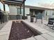 Cozy backyard fire pit area with built-in seating and an outdoor kitchen under a pergola at 19736 E Emperor Blvd, Queen Creek, AZ 85142