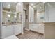 Bathroom showcasing dual vanities, granite countertops, wood-look tile flooring, and a glass enclosed shower at 19736 E Emperor Blvd, Queen Creek, AZ 85142