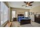 Comfortable bedroom featuring neutral color palette, ceiling fan, and wood furniture at 19736 E Emperor Blvd, Queen Creek, AZ 85142