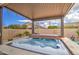 Inviting covered hot tub with a view of the backyard and surrounding greenery at 19736 E Emperor Blvd, Queen Creek, AZ 85142