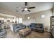 Open-concept living area connects to the kitchen featuring tile floors and ample seating at 19736 E Emperor Blvd, Queen Creek, AZ 85142