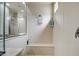 Detail of frameless shower with a built-in bench, shelving and tiled walls at 19736 E Emperor Blvd, Queen Creek, AZ 85142