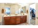 Spacious bathroom featuring a large vanity, double sinks, and decorative lighting at 203 S La Amador Trl, Casa Grande, AZ 85194