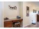 Bright, functional office nook featuring a built-in desk, drawers, and cocktail art accents at 203 S La Amador Trl, Casa Grande, AZ 85194