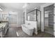 Bright primary bathroom featuring a soaking tub, glass shower, and double vanity at 20979 E Mayberry Rd, Queen Creek, AZ 85142