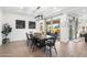 Well-lit dining area featuring a dark wood table with modern light fixture at 20979 E Mayberry Rd, Queen Creek, AZ 85142