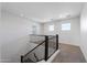 Hallway with staircase leading to a carpeted upper level and bright natural lighting at 20979 E Mayberry Rd, Queen Creek, AZ 85142