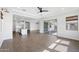 Bright and spacious living room featuring tile floors and sliding glass doors to the outdoor patio at 20979 E Mayberry Rd, Queen Creek, AZ 85142