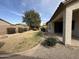 Expansive backyard with lush lawn and desert landscaping offer lots of curb appeal at 2146 E Aloe Pl, Chandler, AZ 85286