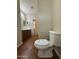 Bathroom featuring tile flooring, single sink vanity, and a toilet with white porcelain at 2146 E Aloe Pl, Chandler, AZ 85286