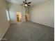 Spacious carpeted bedroom featuring high ceilings and natural light, showing an open closet at 2146 E Aloe Pl, Chandler, AZ 85286