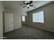 Bedroom featuring carpet, a ceiling fan, a closet, and a window for natural light at 2146 E Aloe Pl, Chandler, AZ 85286