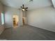 An open bedroom with carpet and natural light, showing an open closet at 2146 E Aloe Pl, Chandler, AZ 85286