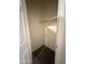 A small walk-in closet with a rod for hanging clothes at 2146 E Aloe Pl, Chandler, AZ 85286