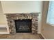 Close-up of a fireplace with a stone surround at 2146 E Aloe Pl, Chandler, AZ 85286