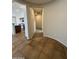 Tiled entryway leading to a hallway with plush carpeting, showcasing an open-concept transition to the kitchen at 2146 E Aloe Pl, Chandler, AZ 85286